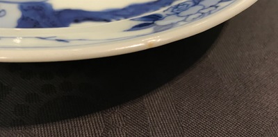 A small Chinese blue and white plate with a monk near the water, Transitional period