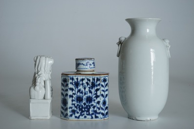 A Chinese Dehua blanc de Chine temple lion, a vase and a blue and white tea caddy, Kangxi and later