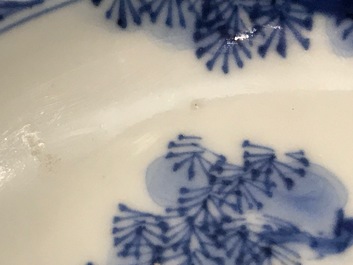 A small Chinese blue and white plate with a monk near the water, Transitional period