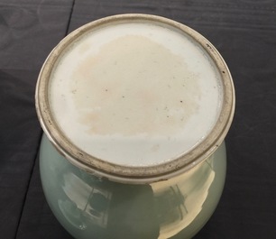 A Chinese monochrome celadon baluster vase and cover, 19th C.