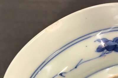 A small Chinese blue and white plate with a monk near the water, Transitional period