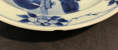 A small Chinese blue and white plate with a monk near the water, Transitional period