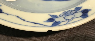 A small Chinese blue and white plate with a monk near the water, Transitional period