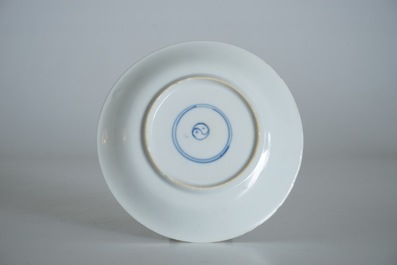 A Chinese famille verte cup and saucer with yin-yang mark, Kangxi