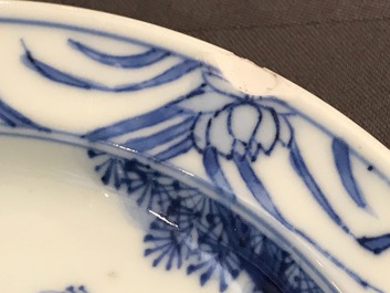 A small Chinese blue and white plate with a monk near the water, Transitional period