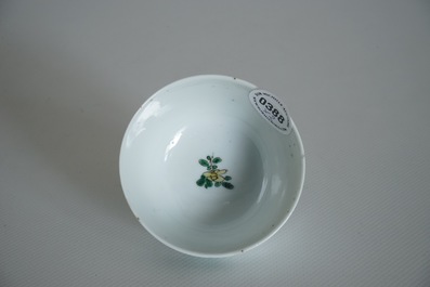 A Chinese famille verte cup and saucer with yin-yang mark, Kangxi