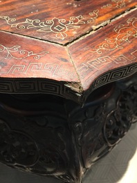 A Chinese carved wood stand with silver wire inlay, 19/20th C.