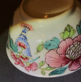 A fine Chinese famille rose cup and saucer with a flowervase, Yongzheng