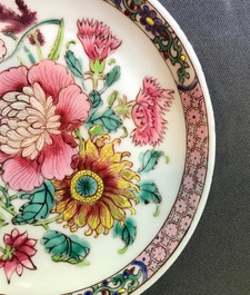 A fine Chinese famille rose cup and saucer with a flowervase, Yongzheng