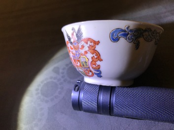 Two Chinese armorial cups and a saucer for the Belgian market, Qianlong