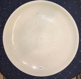 A Chinese Dehua blanc de Chine dish with incised floral design, Kangxi