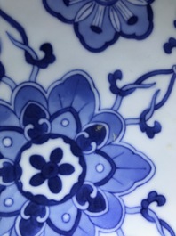 A pair of Chinese famille rose vases and covers, 19th C., and a pair of blue and white dishes, 20th C.