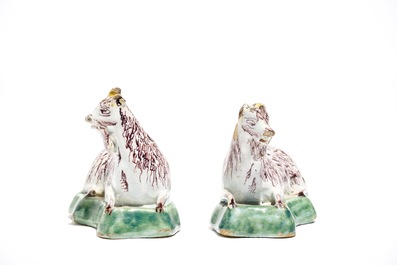 A pair of Dutch Delft polychrome models of goats on a ground, 18th C.