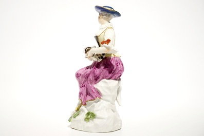 A Meissen porcelain Commedia del'Arte figure of Colombine playing a hurdy-gurdy, Germany, 18th C.