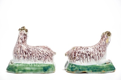 A pair of Dutch Delft polychrome models of goats on a ground, 18th C.