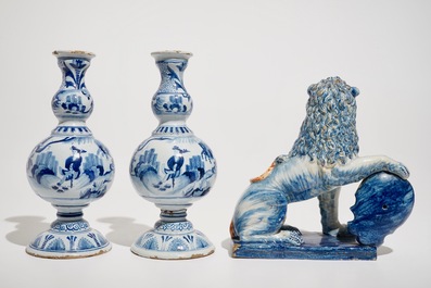 A pair of Delft style blue and white chinoiserie vases and a model of a lion with a shield, France, 19th C.