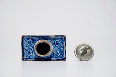 A rectangular Dutch Delft blue and white tea caddy with erotical design, 18th C.