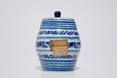 A dated Dutch Delft blue and white barrel-shaped gin flask, 1719