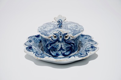 A Dutch Delft blue and white butter tub on stand, 18th C.