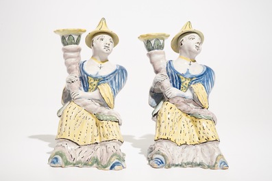 A pair of polychrome Brussels faience candlesticks modelled as chinamen, ca. 1800