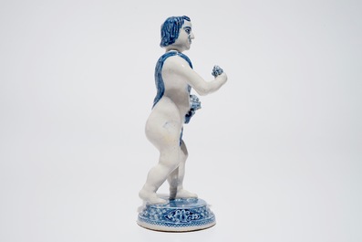 A Dutch Delft blue and white model of Bacchus, early 18th C.