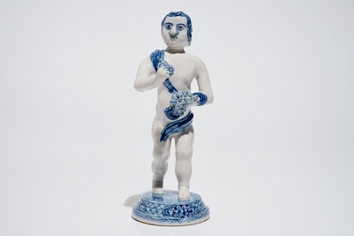 A Dutch Delft blue and white model of Bacchus, early 18th C.