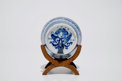 A dated Dutch Delft blue and white barrel-shaped gin flask, 1719