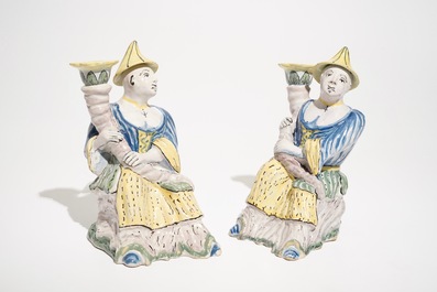 A pair of polychrome Brussels faience candlesticks modelled as chinamen, ca. 1800