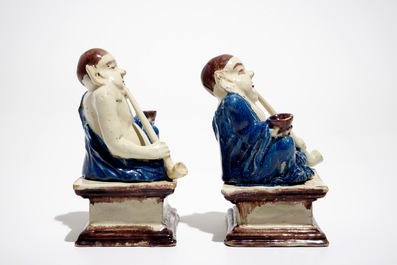 A pair of German faience models of Buddhas in Delft style, 1st half 18th C.