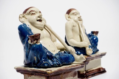 A pair of German faience models of Buddhas in Delft style, 1st half 18th C.