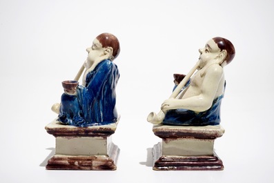 A pair of German faience models of Buddhas in Delft style, 1st half 18th C.