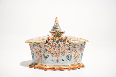A polychrome Dutch Delft petit feu butter tub with a rooster-topped cover, 18th C.