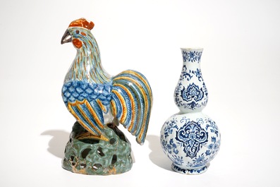 A polychrome Delft style rooster and a blue and white vase, D&egrave;svres, France, 19th C.