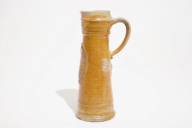 A large Raeren stoneware schnelle type mug with the arms of Frederick IV, dated 1604