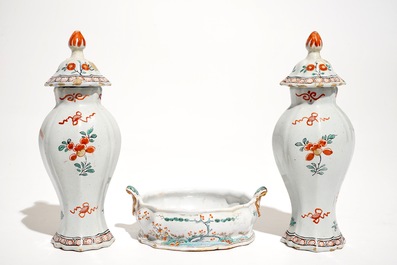 A pair of polychrome Dutch Delft petit feu Kakiemon style vases and a butter tub, 18th C.