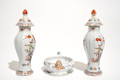 A pair of polychrome Dutch Delft petit feu Kakiemon style vases and a butter tub, 18th C.