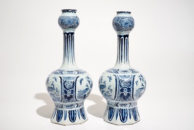 A pair of Dutch Delft blue and white chinoiserie vases and a floral charger, 17/18th C.