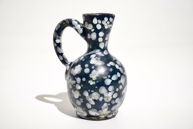 A French faience jug with blue ground &quot;A la bougie&quot; design, Nevers, 17th C.