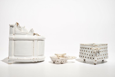 A white Dutch Delft letter holder and two strainers, 18th C.