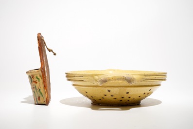 A French stoneware strainer and a wall hanger for cutlery, Aiglefontaine, 18th C.