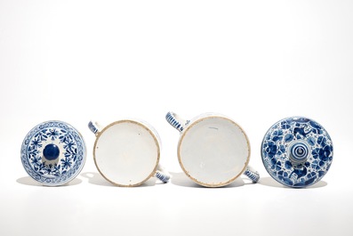 A pair of Dutch Delft blue and white dishes with cherubs and two sugar pots, 18th C.
