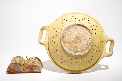 A French stoneware strainer and a wall hanger for cutlery, Aiglefontaine, 18th C.