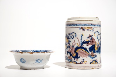A Dutch Delft blue and white chinoiserie bowl and a polychrome Braunschweig mug, 1st half 18th C.