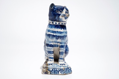 A Dutch Delft blue and white model of a cat, 1st half 19th C.