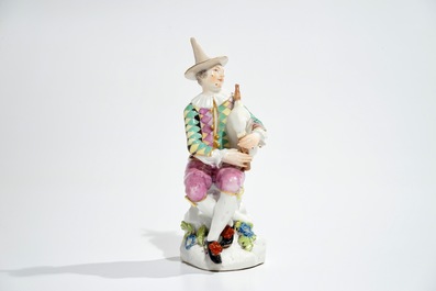 A Meissen porcelain Commedia del'Arte figure of Harlequin playing the bagpipe, 18th C.