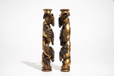 A pair of pillars with grapes, carved wood with gilding and polychromy, 18th C.