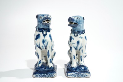 A pair of Dutch Delft blue and white models of dogs, 1st half 18th C.