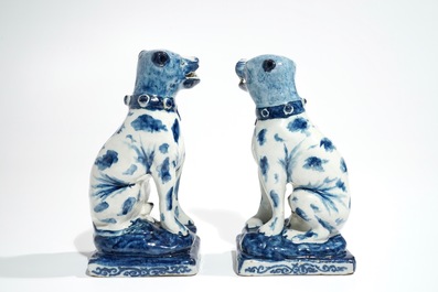 A pair of Dutch Delft blue and white models of dogs, 1st half 18th C.