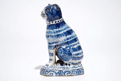 A Dutch Delft blue and white model of a cat, 1st half 19th C.