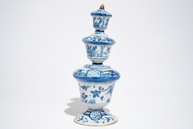 A large Dutch Delft blue and white money bank with polychrome finial, 1st half 18th C.